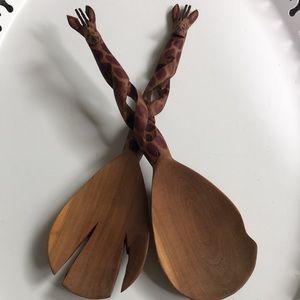 Carved wooden giraffe salad serving utensils.